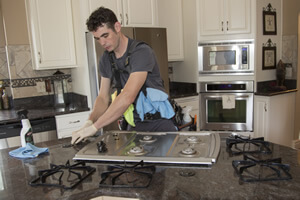 Kal's Precision Cleaning - cleaning a stove top to make it shine like new
